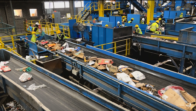 MES and contractors sort recyclable goods as they move across blue conveyor belts at the Prince George's County Materials Recovery Facility.
